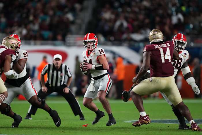 Dec 30, 2023; Miami Gardens, FL, USA; Georgia Bulldogs quarterback Gunner Stockton (14) drops back to pass Florida State Seminoles during the second half in the 2023 Orange Bowl at Hard Rock Stadium.© Jasen Vinlove-USA TODAY Sports